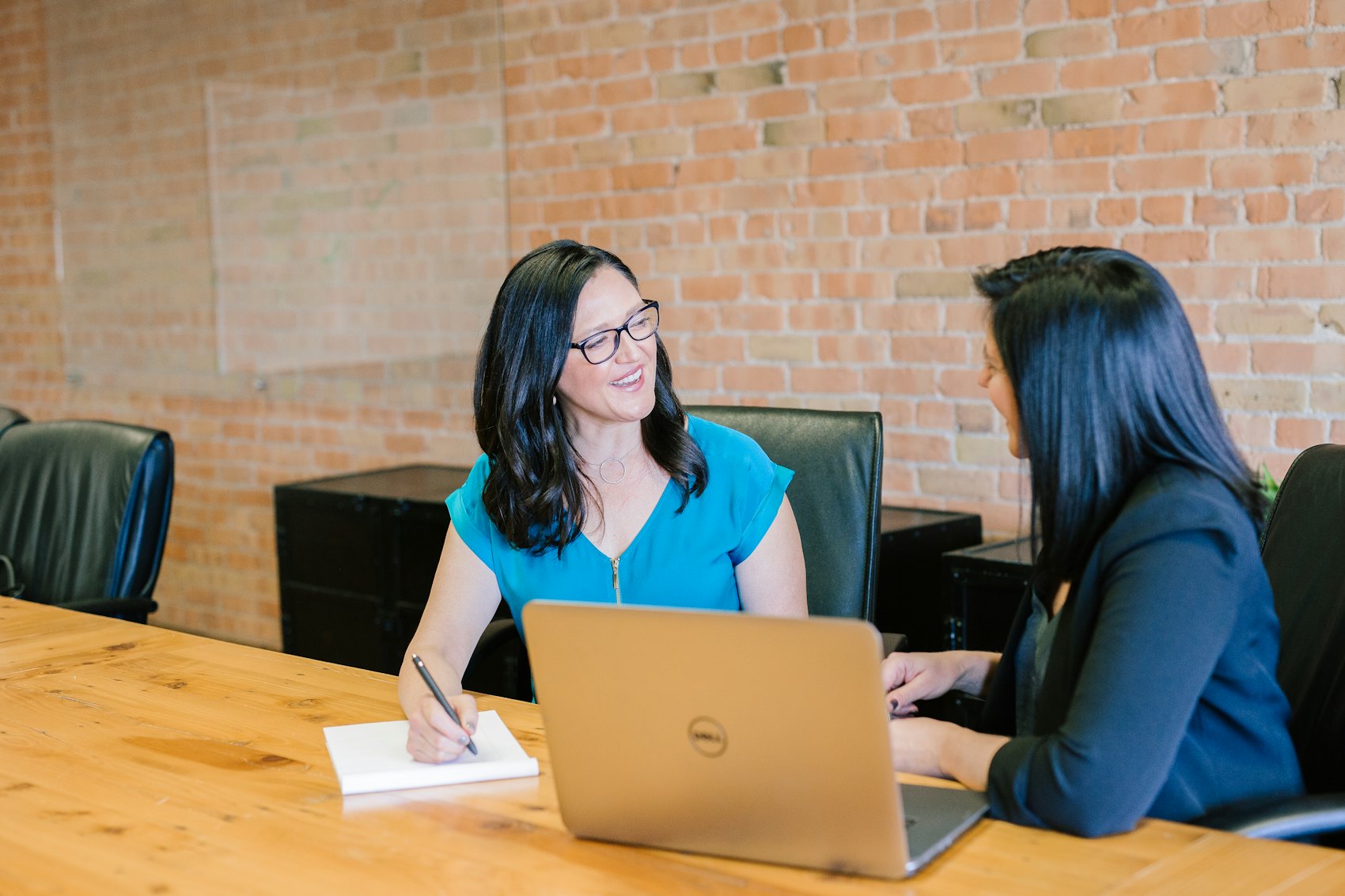 An advisor and client reviewing numbers together